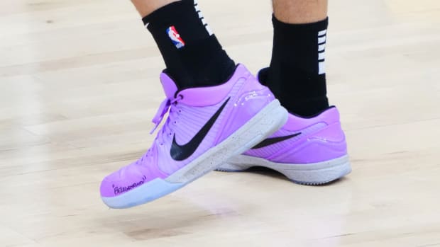 Devin Booker wears Nike Kobe 4 Protro on cover of NBA 2K23.